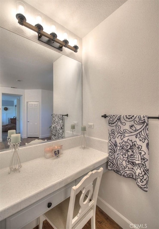 14182 Whitebark Ave, Chino, CA 91710 - bathroom with a textured ceiling and vanity
