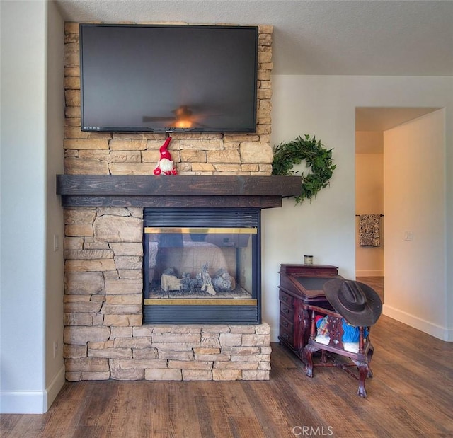14182 Whitebark Ave, Chino, CA 91710 - detailed view of wood finished floors and a stone fireplace