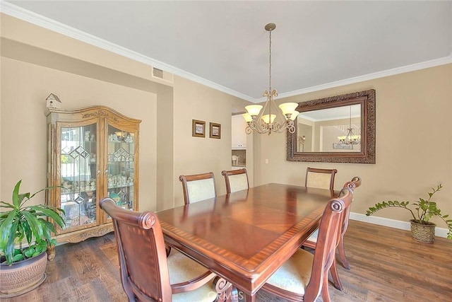 14182 Whitebark Ave, Chino, CA 91710 - dining room with a chandelier, dark wood-style floors, and ornamental molding