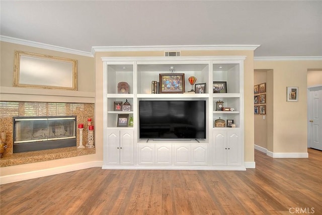 14182 Whitebark Ave, Chino, CA 91710 - living area featuring ornamental molding, wood finished floors, built in shelves, and a tile fireplace