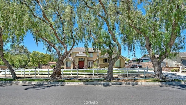 14182 Whitebark Ave, Chino, CA 91710 - view of front facade with stucco siding and a fenced front yard