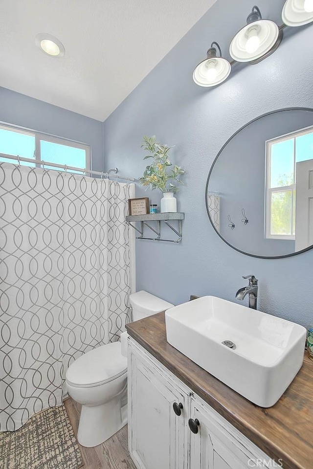 14182 Whitebark Ave, Chino, CA 91710 - full bath with vanity, a shower with curtain, and wood finished floors