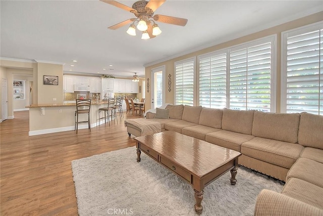 14182 Whitebark Ave, Chino, CA 91710 - living room featuring a ceiling fan, ornamental molding, light wood finished floors, and recessed lighting