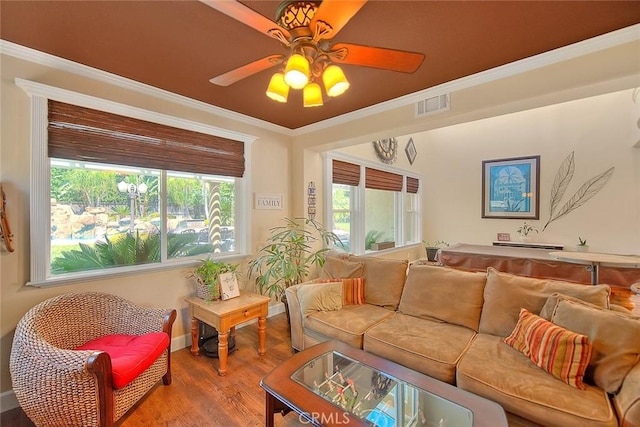 14182 Whitebark Ave, Chino, CA 91710 - living area with wood finished floors, ceiling fan, and ornamental molding