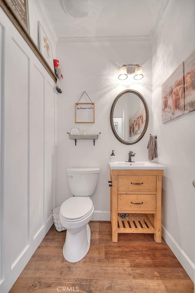 14182 Whitebark Ave, Chino, CA 91710 - bathroom featuring crown molding, vanity, and wood finished floors