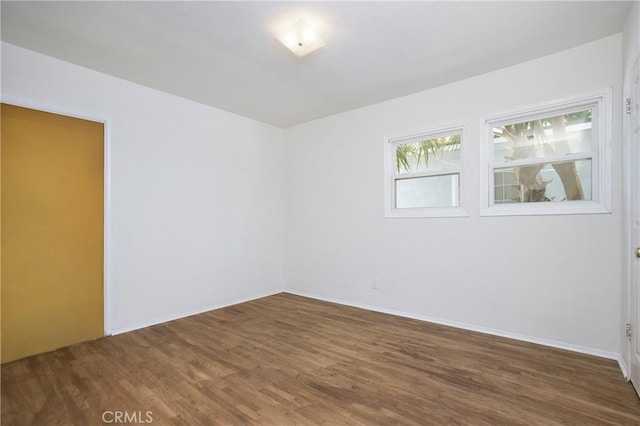 2210 W 7th St, Santa Ana, CA 92703 - spare room featuring wood finished floors and baseboards