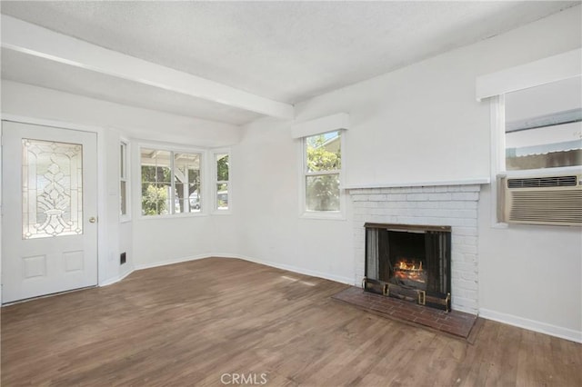 2210 W 7th St, Santa Ana, CA 92703 - unfurnished living room with a brick fireplace, wood finished floors, healthy amount of natural light, and beamed ceiling