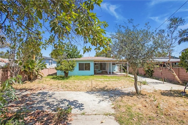 2210 W 7th St, Santa Ana, CA 92703 - rear view of house with a fenced backyard and a patio area