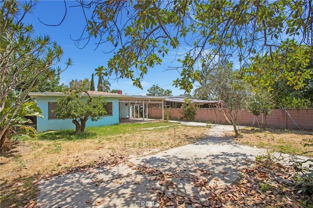 2210 W 7th St, Santa Ana, CA 92703 - rear view of property featuring a fenced backyard and a patio area