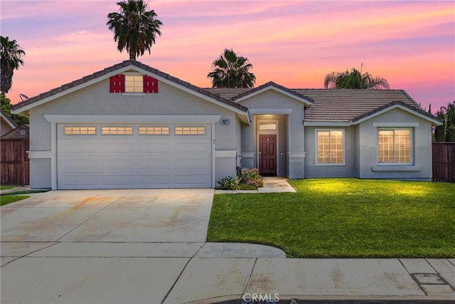 7471 Windrose Dr, Highland, CA 92346 - ranch-style house featuring an attached garage, concrete driveway, a tile roof, and stucco siding