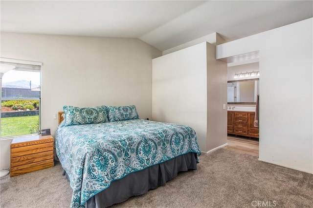 7471 Windrose Dr, Highland, CA 92346 - bedroom with carpet floors, lofted ceiling, and ensuite bathroom