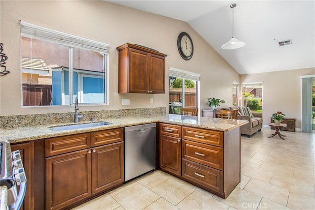 7471 Windrose Dr, Highland, CA 92346 - kitchen featuring appliances with stainless steel finishes, a peninsula, lofted ceiling, open floor plan, and light stone counters