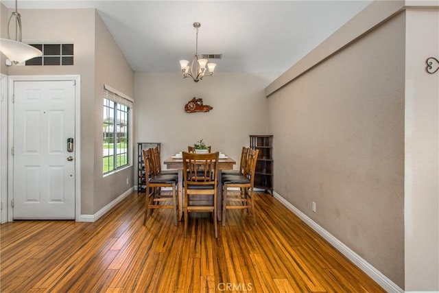 7471 Windrose Dr, Highland, CA 92346 - dining room with a chandelier and hardwood / wood-style flooring