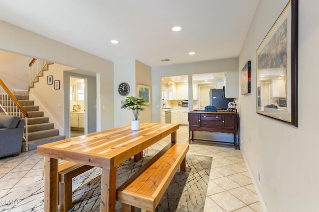 6613 Sargent Ln Unit 86, Ventura, CA 93003 - dining room with light tile patterned floors, stairs, and recessed lighting