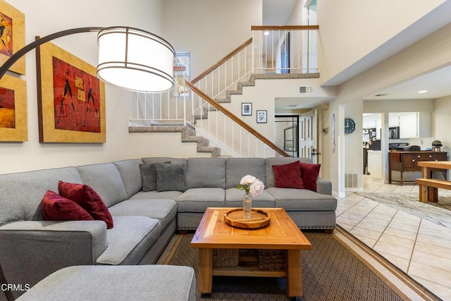 6613 Sargent Ln Unit 86, Ventura, CA 93003 - living room featuring stairs, a high ceiling, and recessed lighting