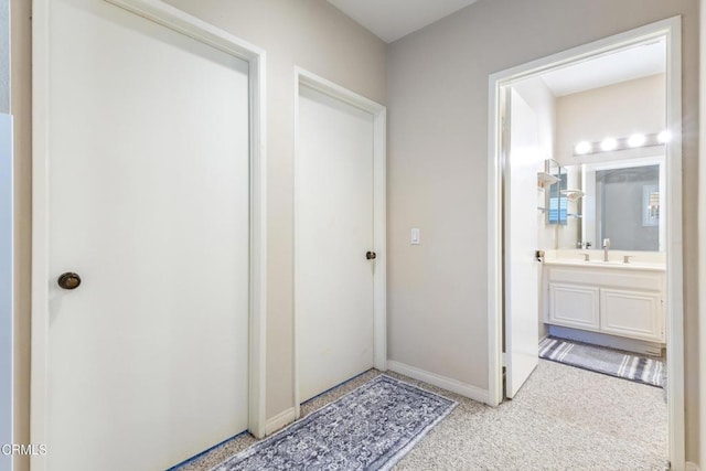 6613 Sargent Ln Unit 86, Ventura, CA 93003 - corridor with a sink and light carpet