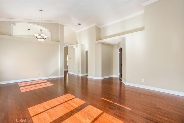769 Amber Sky St, Banning, CA 92220 - empty room with a chandelier, ornamental molding, wood finished floors, and high vaulted ceiling