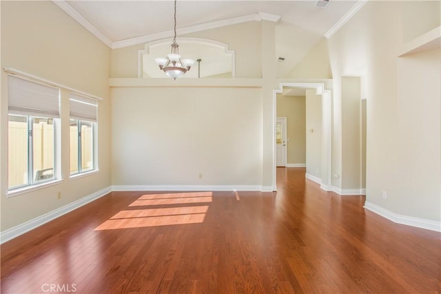 769 Amber Sky St, Banning, CA 92220 - unfurnished room with ornamental molding, a chandelier, wood finished floors, and a high ceiling