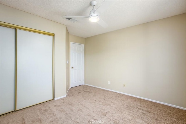 769 Amber Sky St, Banning, CA 92220 - unfurnished bedroom with carpet floors, a closet, a ceiling fan, and a textured ceiling