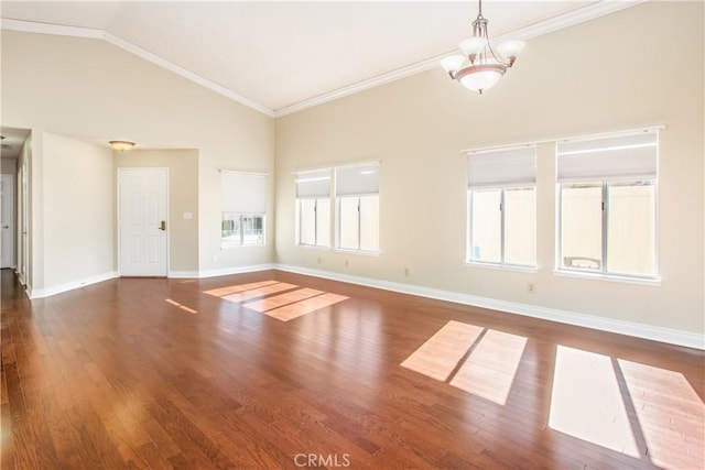 769 Amber Sky St, Banning, CA 92220 - spare room with wood finished floors, high vaulted ceiling, crown molding, and a chandelier