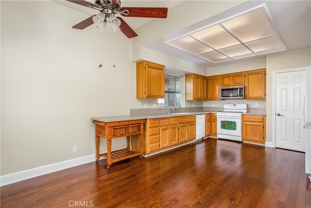 769 Amber Sky St, Banning, CA 92220 - kitchen with white appliances, light countertops, dark wood-style flooring, and ceiling fan