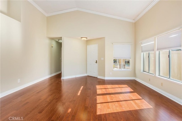769 Amber Sky St, Banning, CA 92220 - empty room featuring wood-type flooring, lofted ceiling, and crown molding
