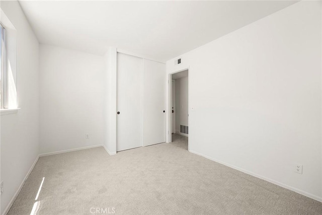 18312 Hartlund Ln, Huntington Beach, CA 92646 - spare room with light carpet and baseboards
