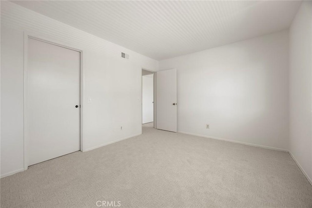 18312 Hartlund Ln, Huntington Beach, CA 92646 - unfurnished bedroom with light colored carpet and a closet