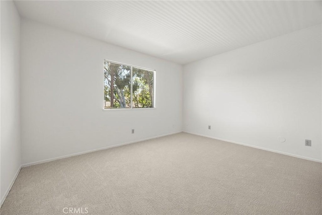 18312 Hartlund Ln, Huntington Beach, CA 92646 - unfurnished room with light carpet