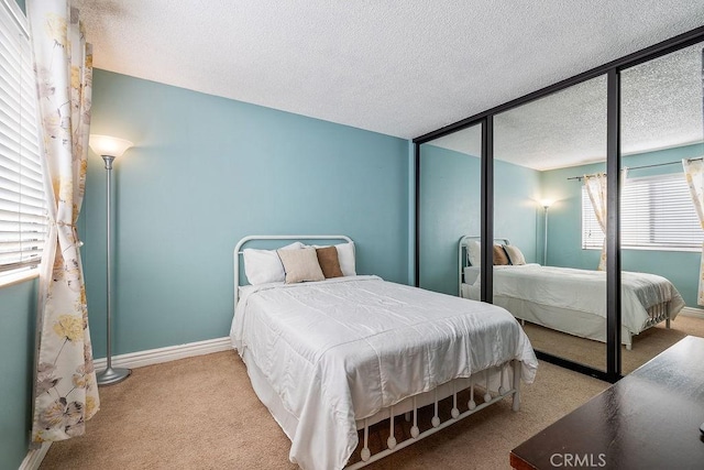 27066 Hidaway Ave Unit 6, Canyon Country, CA 91351 - carpeted bedroom featuring a textured ceiling and baseboards