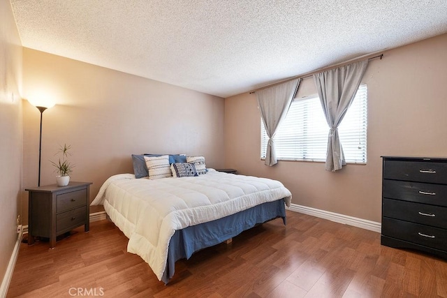 27066 Hidaway Ave Unit 6, Canyon Country, CA 91351 - bedroom featuring light wood-style floors and a textured ceiling