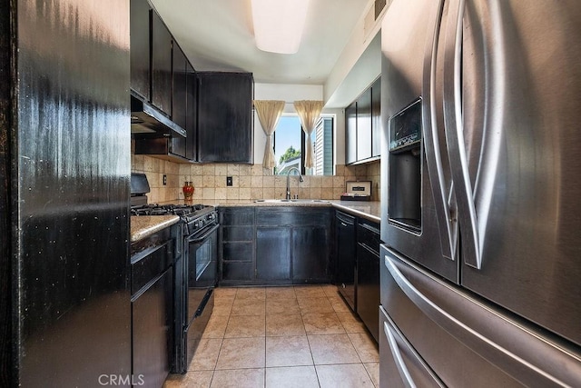 27066 Hidaway Ave Unit 6, Canyon Country, CA 91351 - kitchen with black appliances, under cabinet range hood, decorative backsplash, and light tile patterned floors
