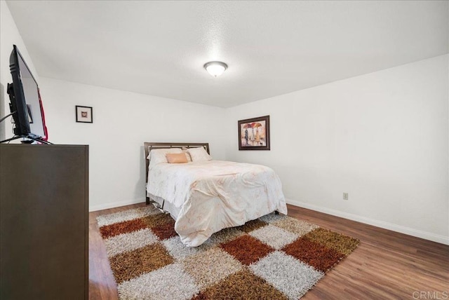 7394 Altiva Pl, Carlsbad, CA 92009 - bedroom with wood finished floors and baseboards