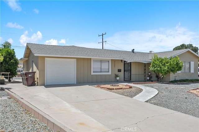 26480 Ridgemoor Rd, Menifee, CA 92586 - single story home featuring a garage, a shingled roof, concrete driveway, and board and batten siding