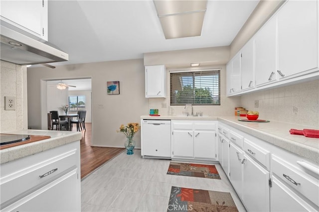 26480 Ridgemoor Rd, Menifee, CA 92586 - kitchen featuring dishwasher, ventilation hood, light countertops, black electric stovetop, and white cabinetry