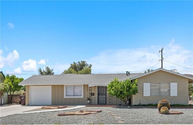 26480 Ridgemoor Rd, Menifee, CA 92586 - ranch-style home featuring an attached garage, concrete driveway, board and batten siding, and a shingled roof