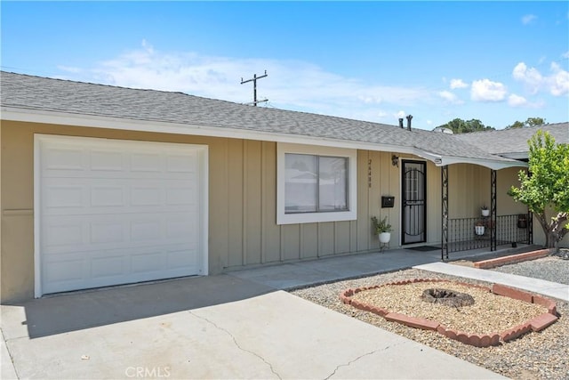 26480 Ridgemoor Rd, Menifee, CA 92586 - ranch-style house with driveway, an attached garage, roof with shingles, and board and batten siding