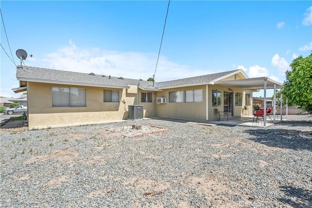 26480 Ridgemoor Rd, Menifee, CA 92586 - rear view of house featuring a patio, stucco siding, and a wall mounted air conditioner