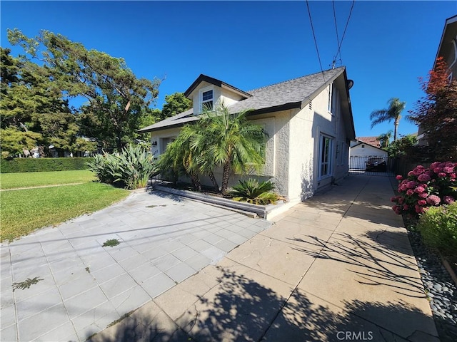 8420 E Hermosa Dr, San Gabriel, CA 91775 - view of side of property featuring stucco siding, a yard, and a patio