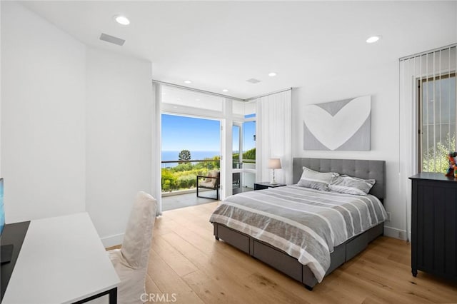 1061 Skyline Dr, Laguna Beach, CA 92651 - bedroom with wood finished floors, recessed lighting, and expansive windows