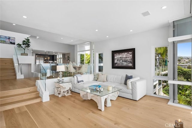 1061 Skyline Dr, Laguna Beach, CA 92651 - living room with wood finished floors, plenty of natural light, recessed lighting, and stairway