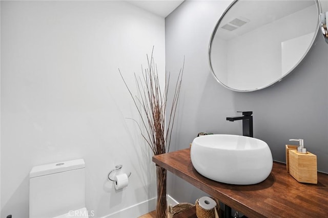 1061 Skyline Dr, Laguna Beach, CA 92651 - half bath with wood finished floors and vanity