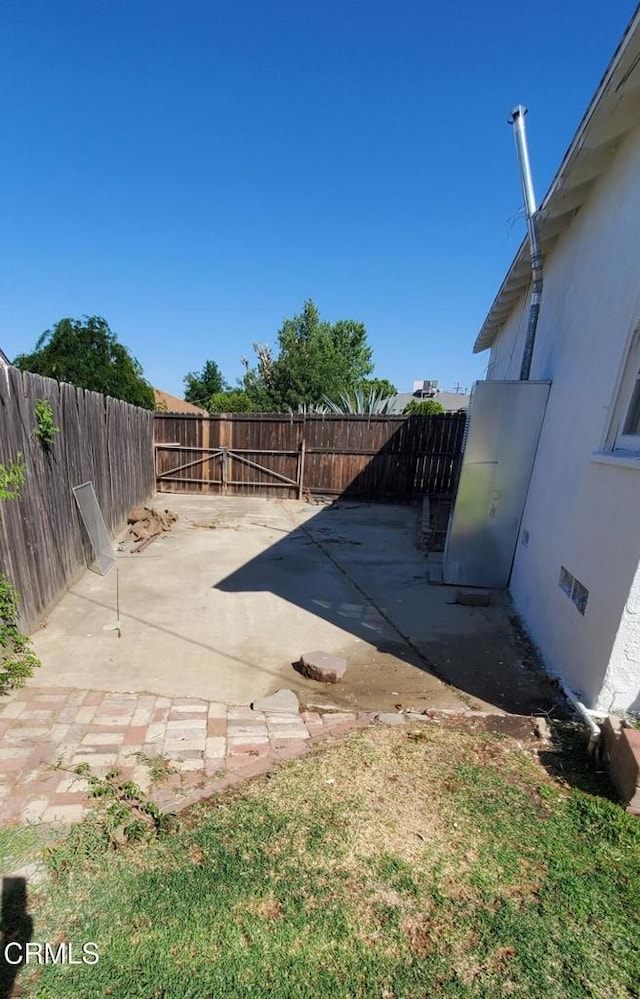701 Francis St, Bakersfield, CA 93303 - fenced backyard with a patio area