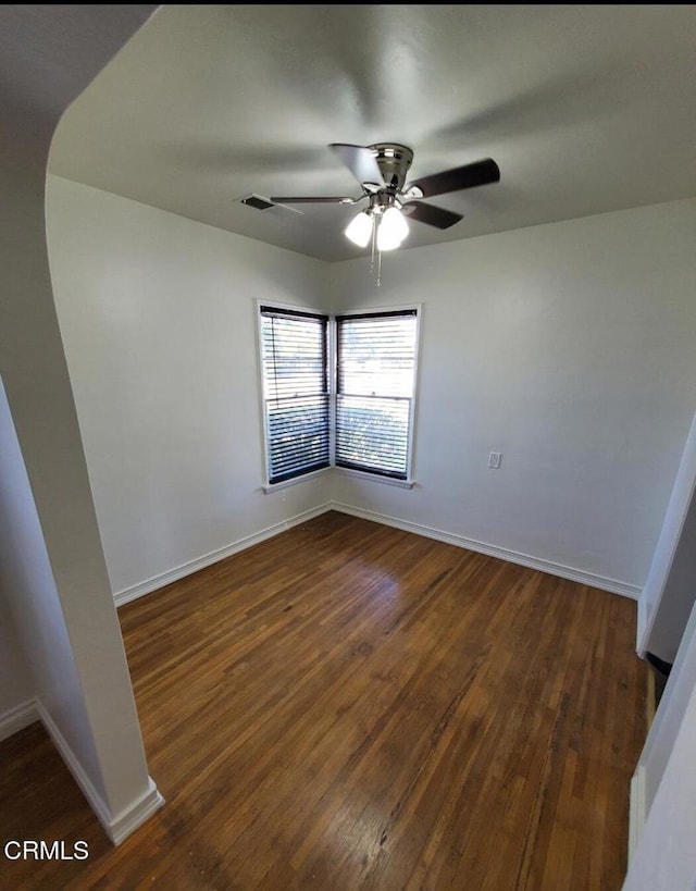 701 Francis St, Bakersfield, CA 93303 - unfurnished room featuring ceiling fan and dark wood-style flooring