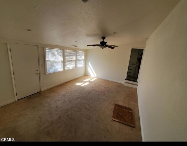 701 Francis St, Bakersfield, CA 93303 - unfurnished living room featuring carpet and ceiling fan
