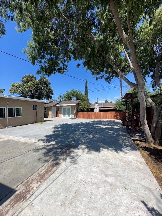9387 Frankfort Ave, Fontana, CA 92335 - view of front of house with stucco siding and french doors
