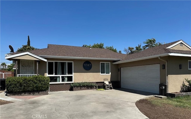 9387 Frankfort Ave, Fontana, CA 92335 - single story home with stucco siding, concrete driveway, a garage, and a shingled roof