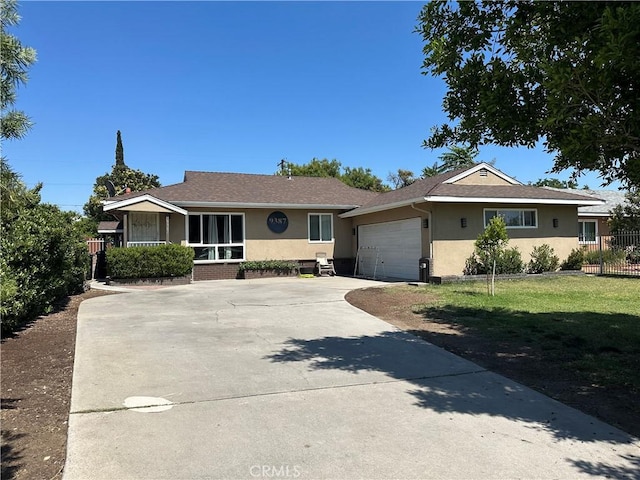 9387 Frankfort Ave, Fontana, CA 92335 - ranch-style home with stucco siding, driveway, and a garage