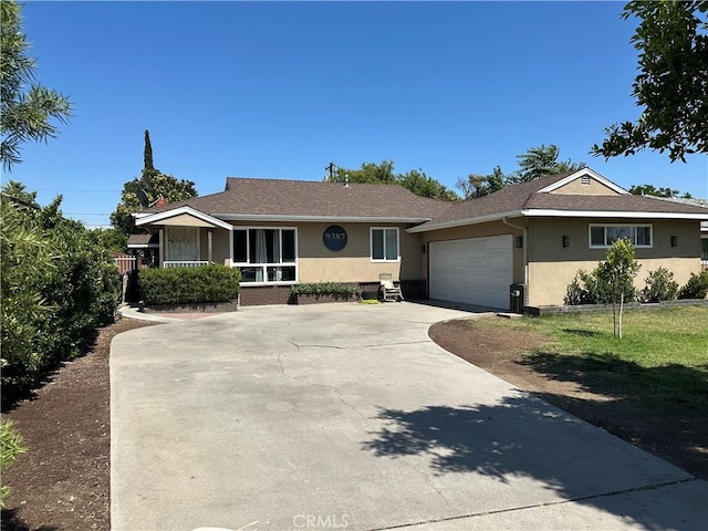 9387 Frankfort Ave, Fontana, CA 92335 - ranch-style home with stucco siding, concrete driveway, a garage, and roof with shingles