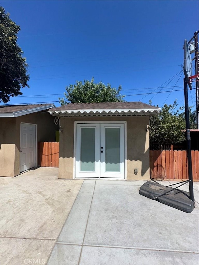 9387 Frankfort Ave, Fontana, CA 92335 - rear view of property with stucco siding, french doors, and a patio area